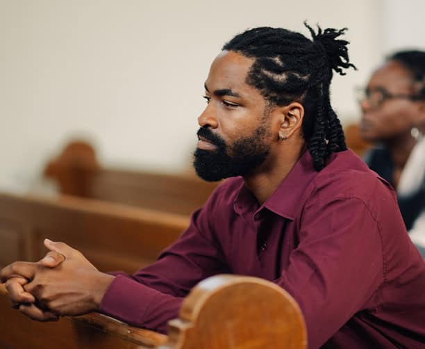 Man Praying In Church